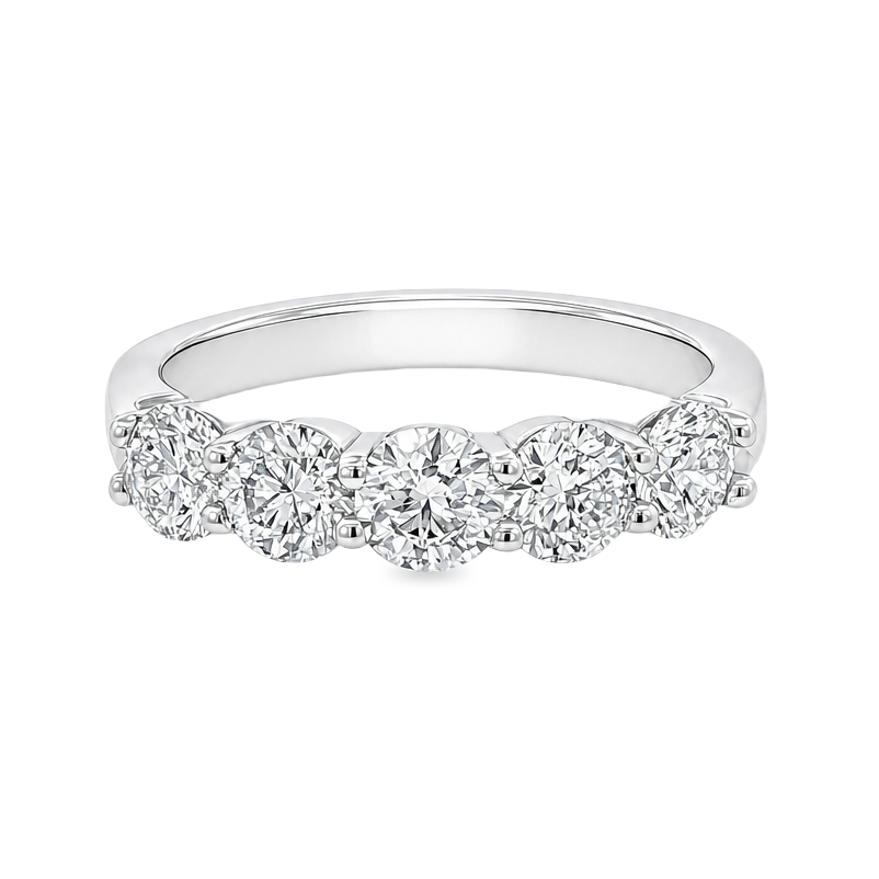 White gold band with 5 round brilliant diamonds in a shared prong setting