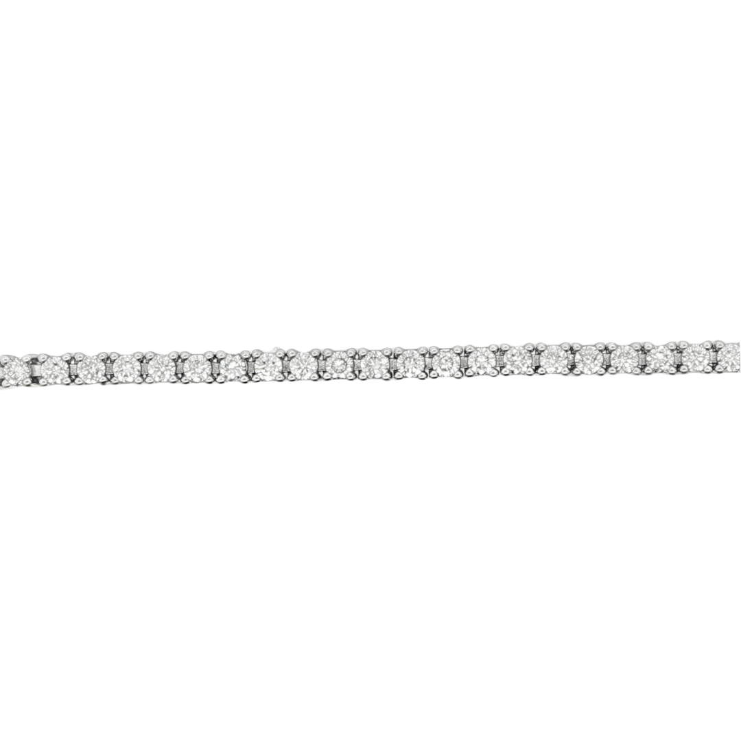 14K white gold tennis bracelet set with round brilliant diamonds. Item J38668 - ABC Jewelry Co.