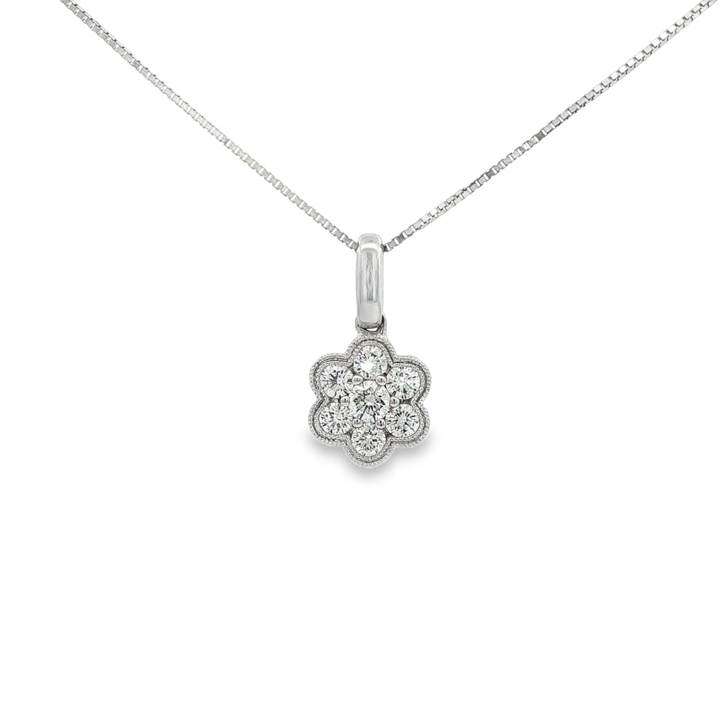 Diamond cluster pendant in floral design, set with round brilliant diamonds. Item J30348 - ABC Jewelry Co.