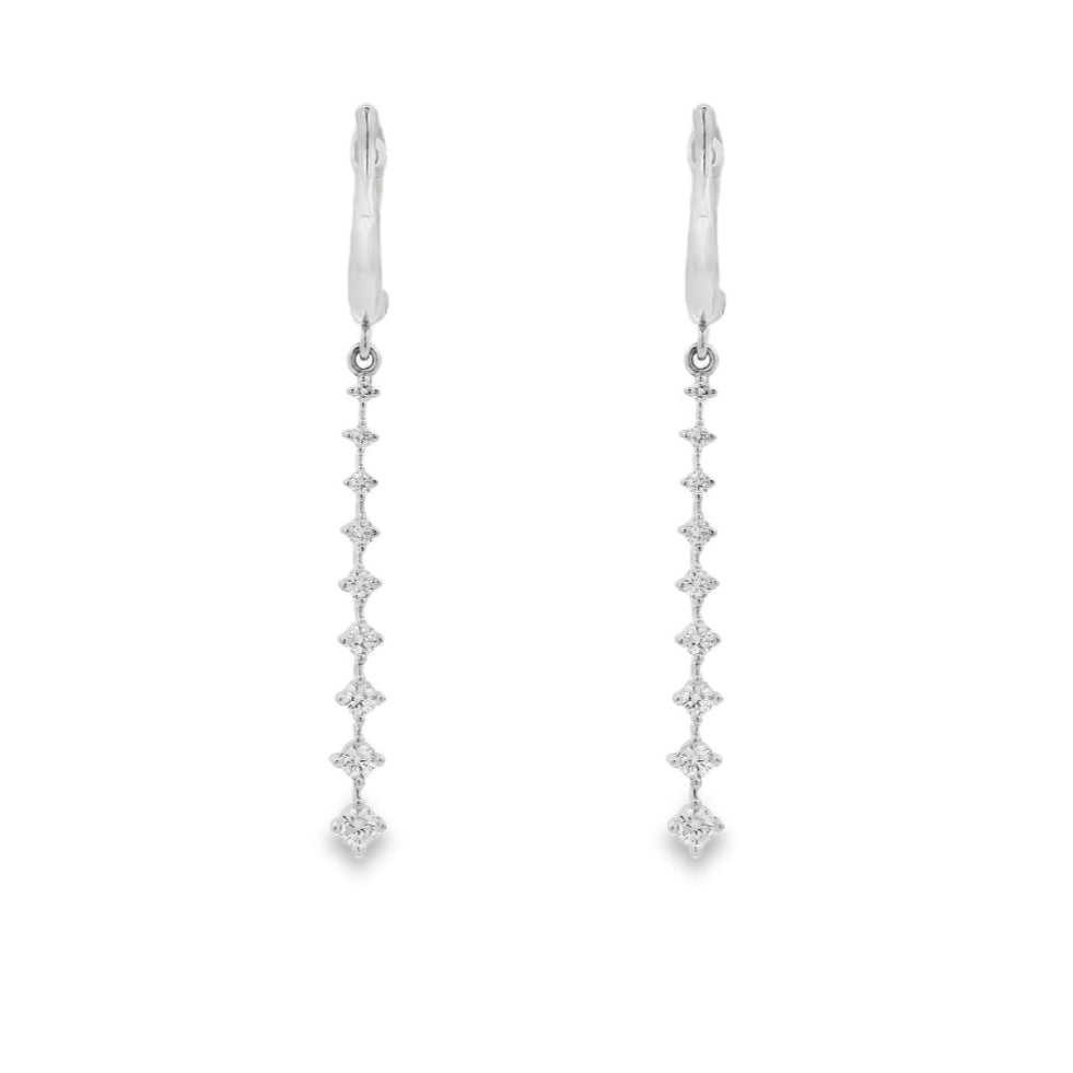 18K White gold dangle earrings with a vertical cascade of round brilliant diamonds. Item J36006 - ABC Jewelry Co