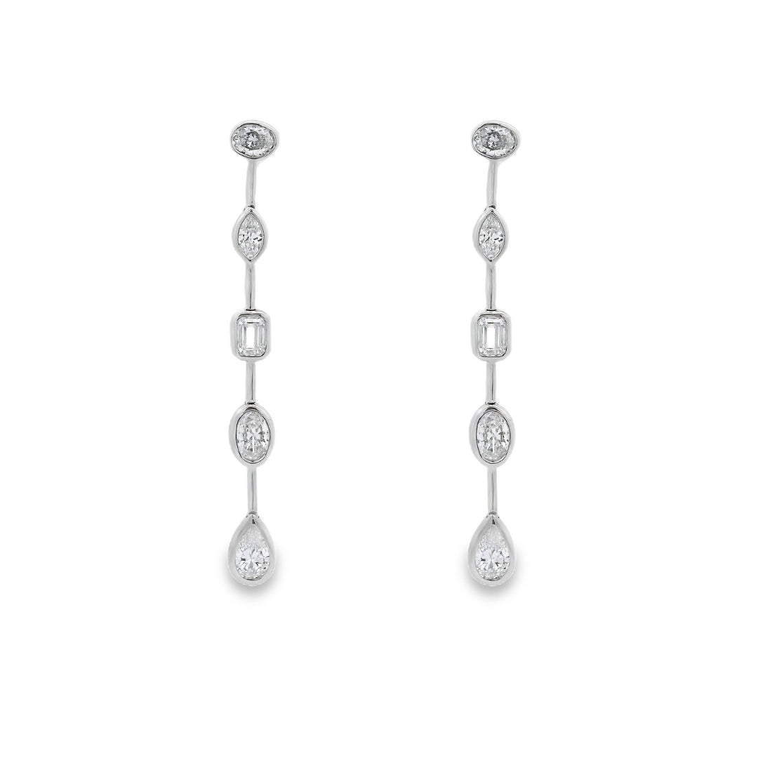 18K White gold dangle earrings featuring diamonds of assorted shapes. Item J37723 - ABC Jewelry Co