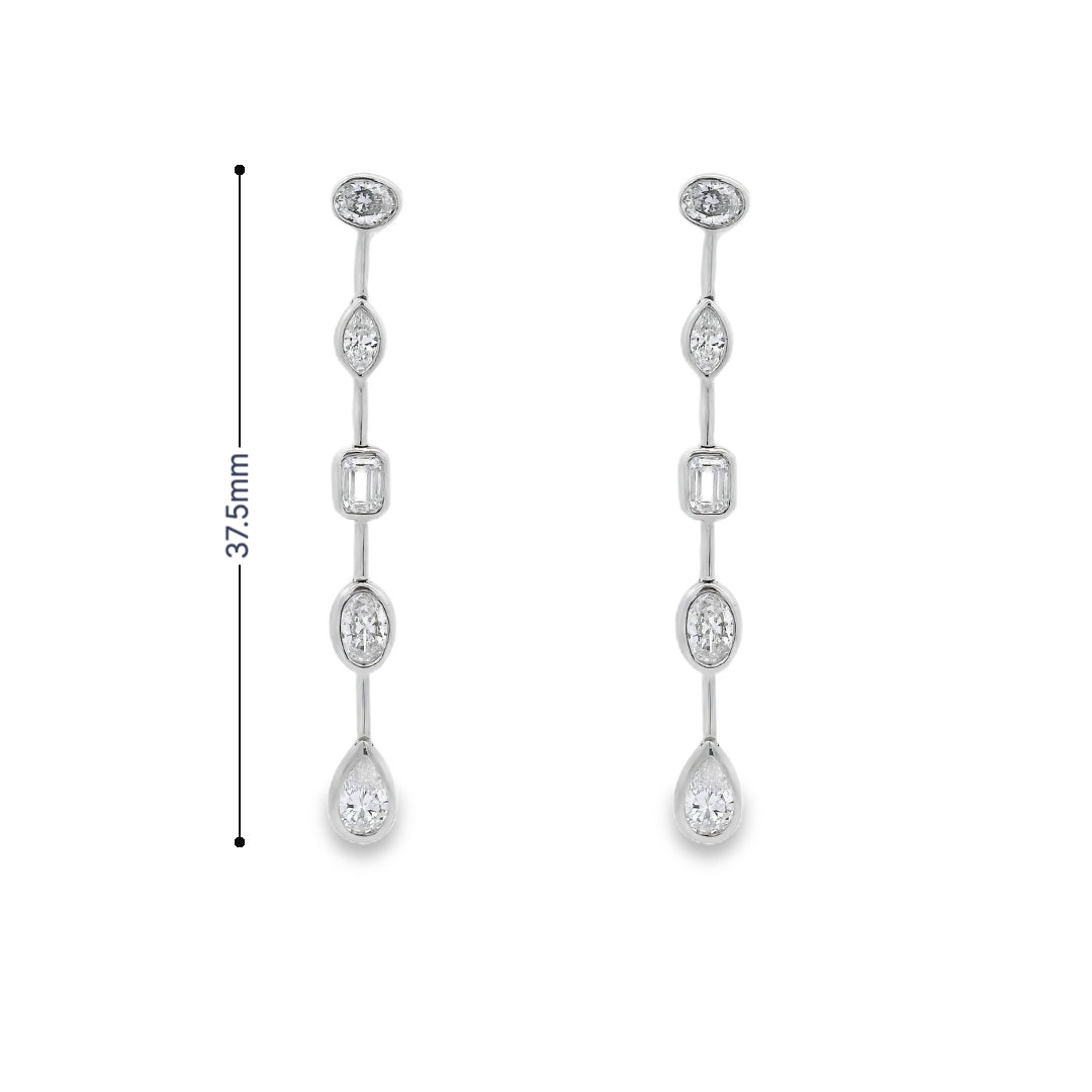 18K White gold dangle earrings featuring diamonds of assorted shapes. Item J37723 - ABC Jewelry Co
