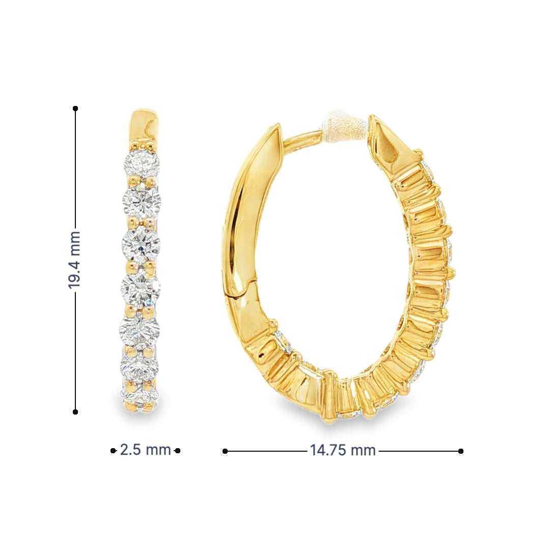 14K Yellow gold oval hoop earrings set with round brilliant diamonds. Item J38766 - ABC Jewelry Co.