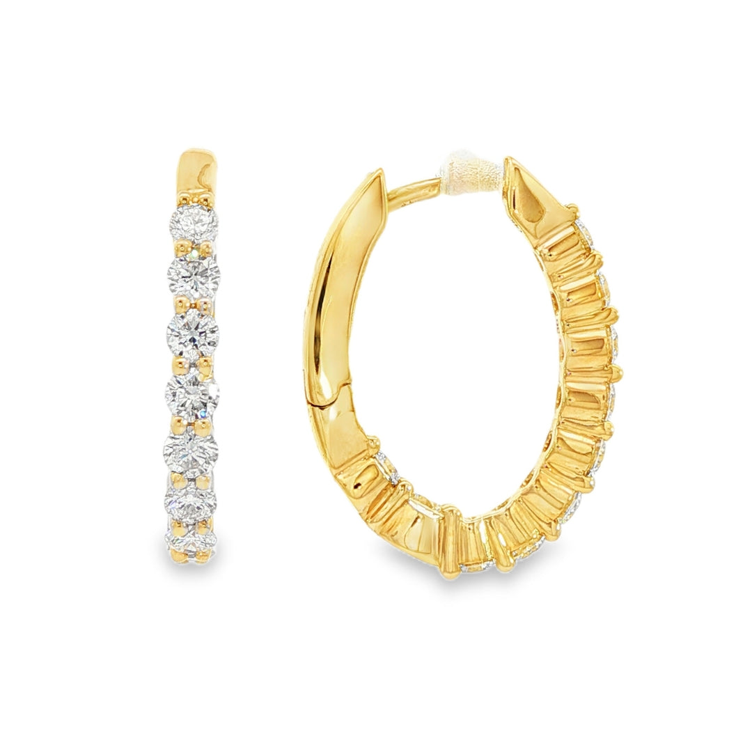 14K Yellow gold oval hoop earrings set with round brilliant diamonds. Item J38766 - ABC Jewelry Co.
