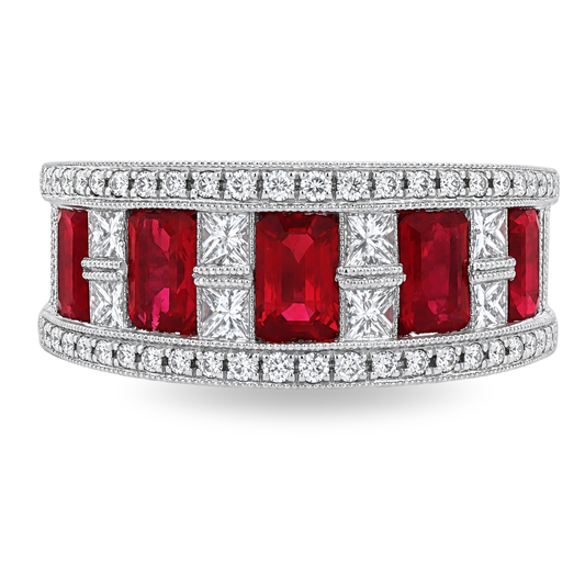 A wide silver band ring featuring large rectangular red gemstones in the center, flanked by pavé-set clear stones, shown on a plain white background.