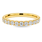 A yellow gold band featuring a continuous row of round-cut diamonds set in a prong setting, shown on a clean white background.