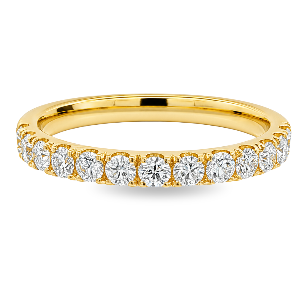 A yellow gold band featuring a continuous row of round-cut diamonds set in a prong setting, shown on a clean white background.