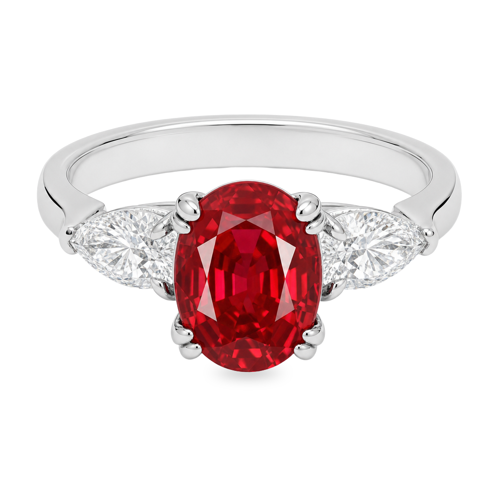 An oval-cut red ruby ring set in a white band with two pear shape clear diamonds on each side, shown against a plain white background.