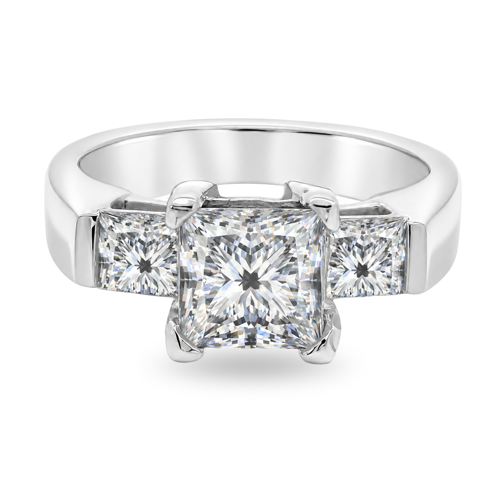 A three-stone diamond ring featuring a large princess-cut center diamond flanked by two smaller princess-cut side diamonds, set in a polished white gold band on a clean white background.
