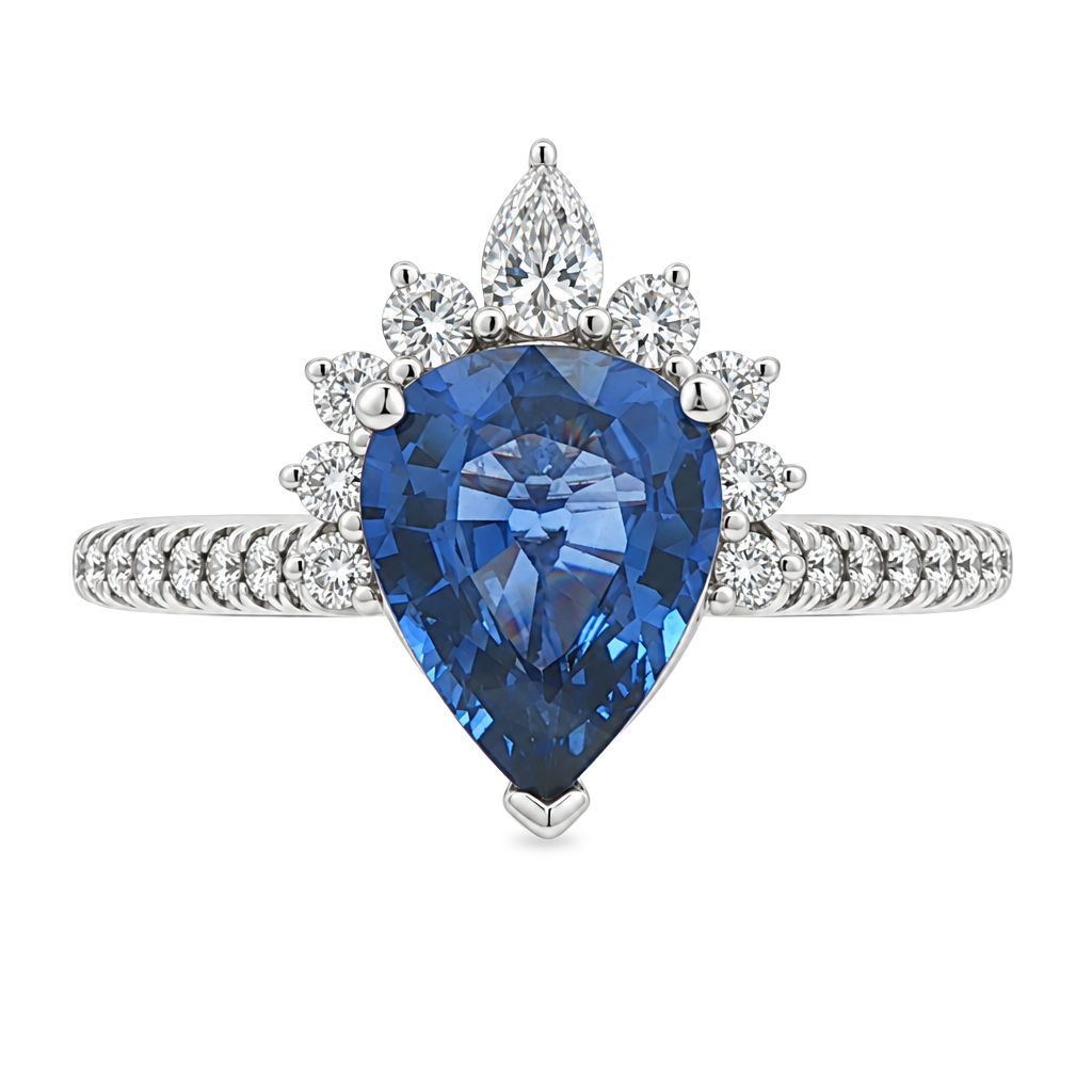 White gold ring set with a pear shape blue sapphire with a graduated half halo of diamonds and diamonds on the band. Set on a clean white background.