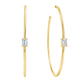 A pair of gold hoop earrings with a single rectangular baguette diamond in a prong setting on each earring, shown against a plain white background.