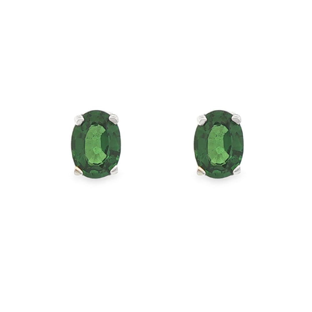 14K White gold stud earrings set with oval cut green tsavorites. Item 18874 - ABC Jewelry Co. 