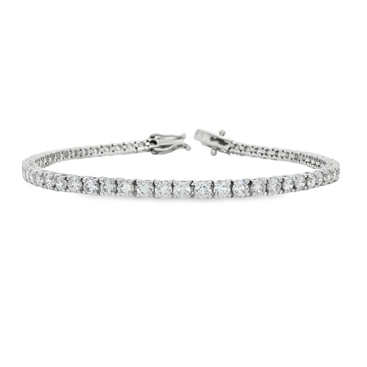 14K White gold tennis bracelet set with round brilliant diamonds. Item J38669 - ABC Jewelry Co. 