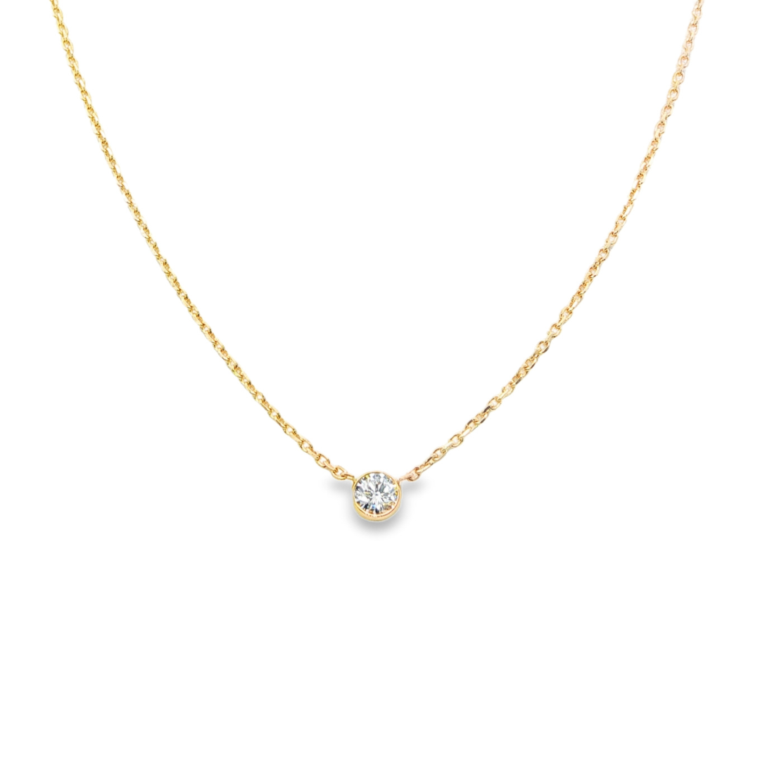 14K Yellow gold necklace with one bezel set round brilliant diamond. Item J38629 - ABC Jewelry Co. 