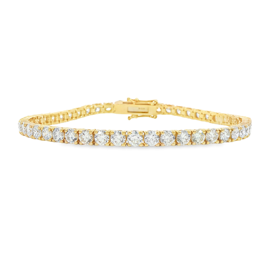 14K Yellow gold tennis bracelet set with round brilliant diamonds. Item J38986 - ABC Jewelry Co. 