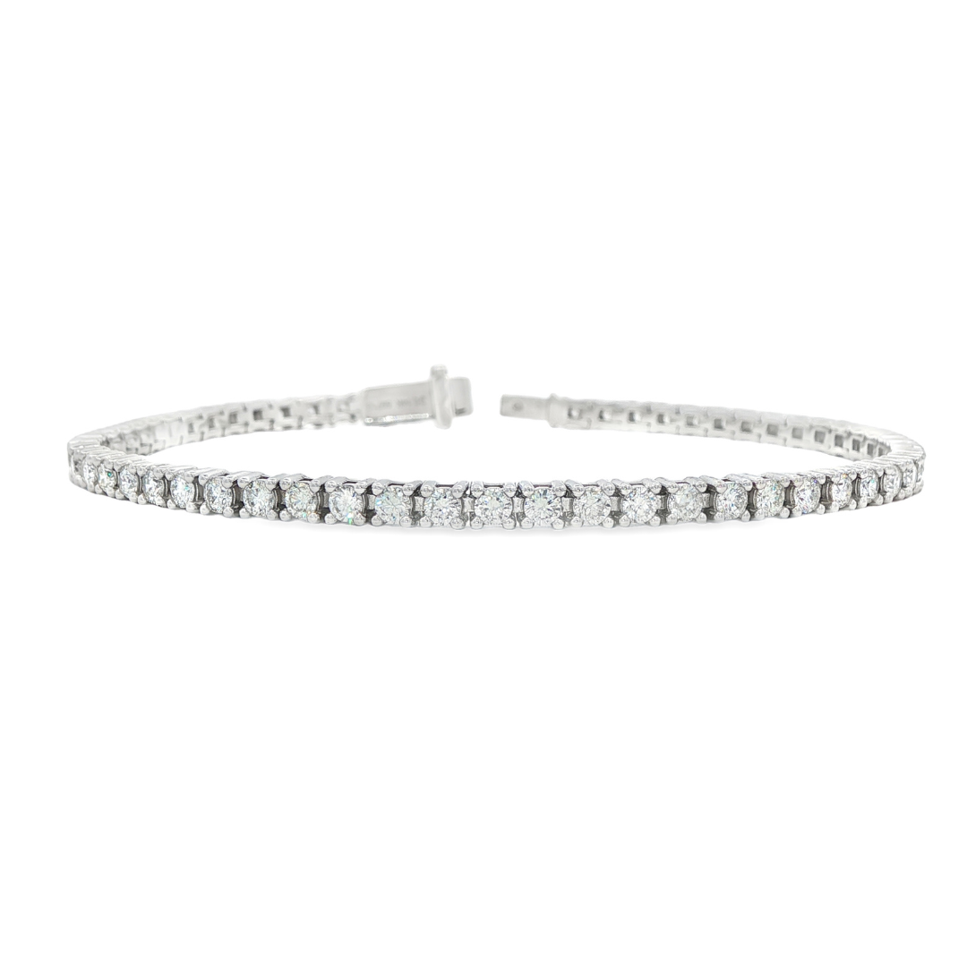 14K white gold tennis bracelet set with round brilliant diamonds. Item J38668 - ABC Jewelry Co.