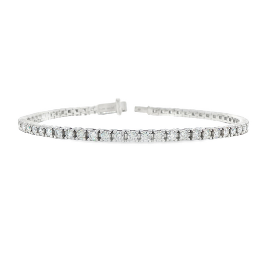 14K white gold tennis bracelet set with round brilliant diamonds. Item J38668 - ABC Jewelry Co.