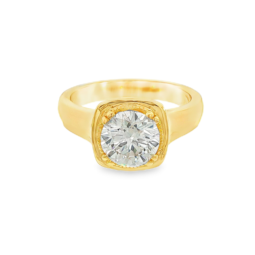 14K Yellow gold ring set with a round brilliant diamond, featuring mill grain detailing. Item J38079 - ABC Jewelry Co.