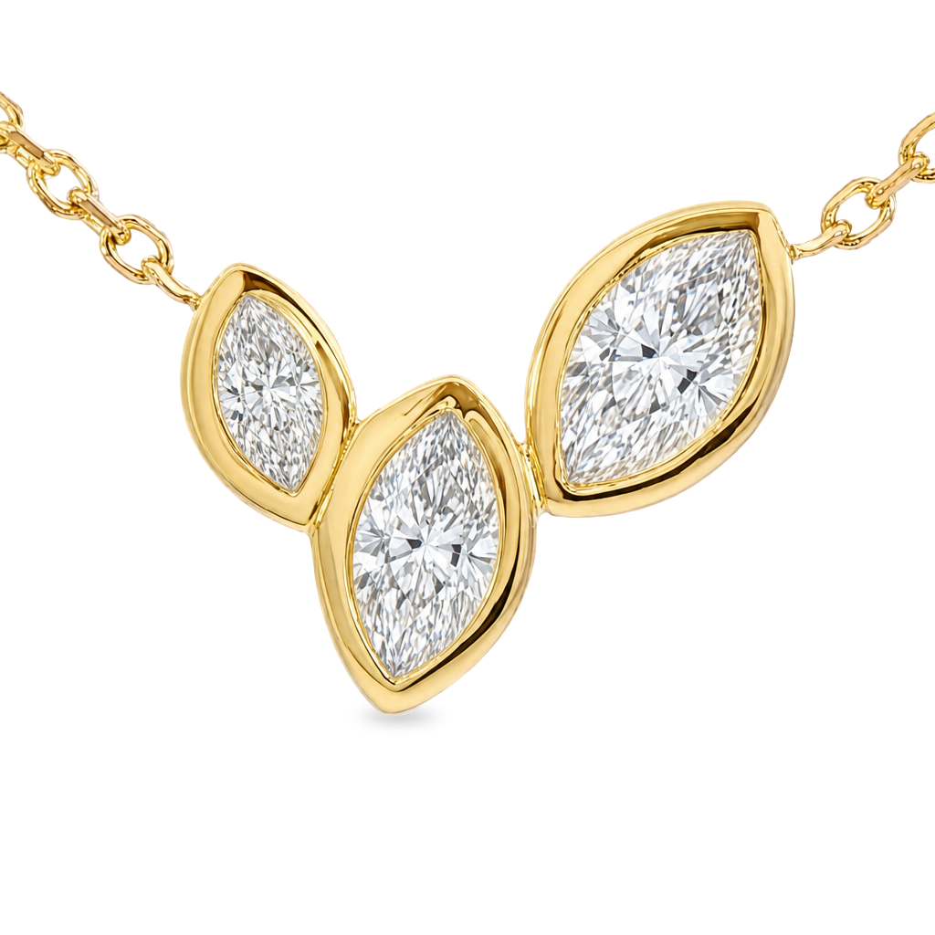 A delicate gold chain necklace featuring a small three-leaf pendant made of gold and clear marquise-cut diamonds, shown against a plain white background.