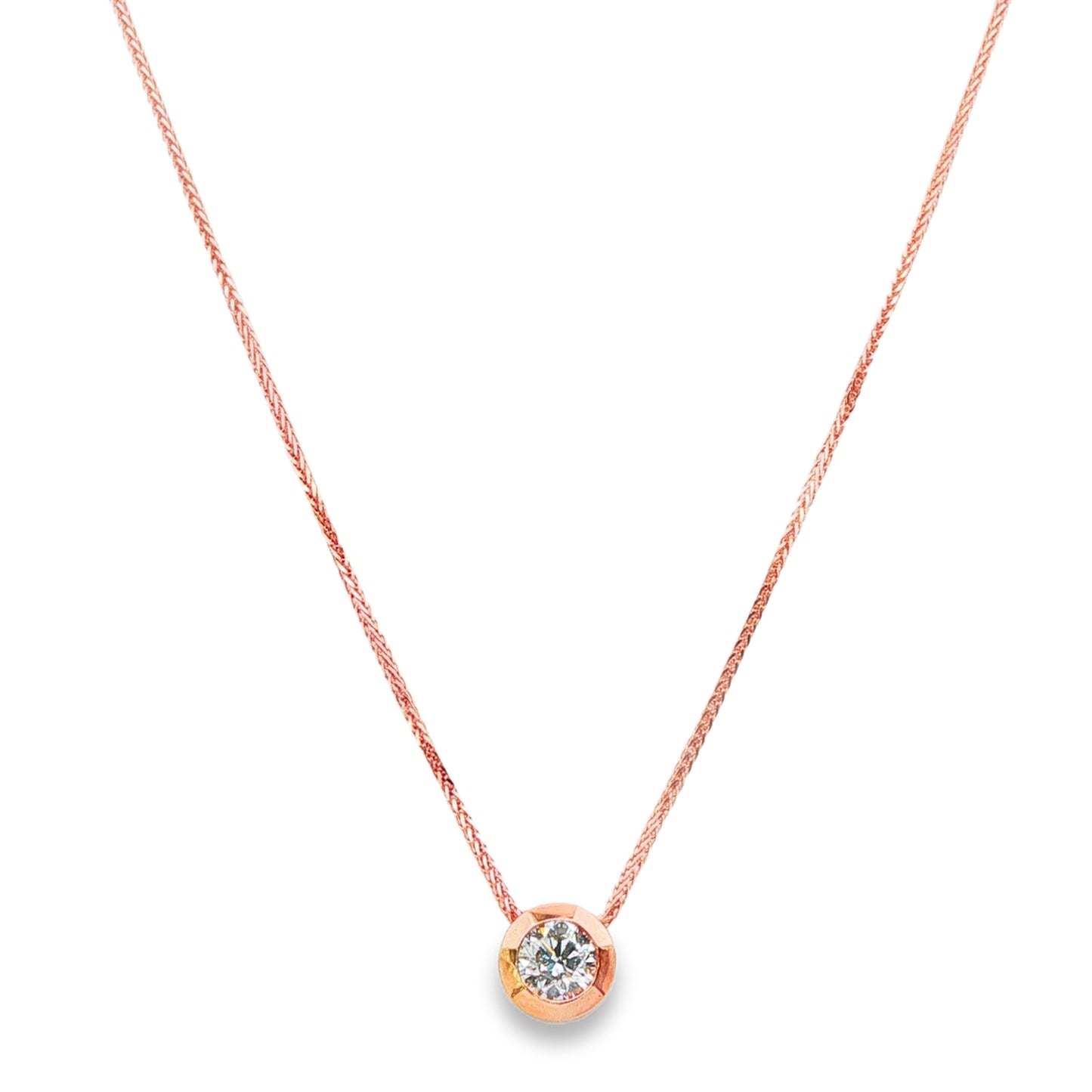 14K Rose gold solitaire necklace set with a round brilliant diamond. Item 24495 - ABC Jewelry Co