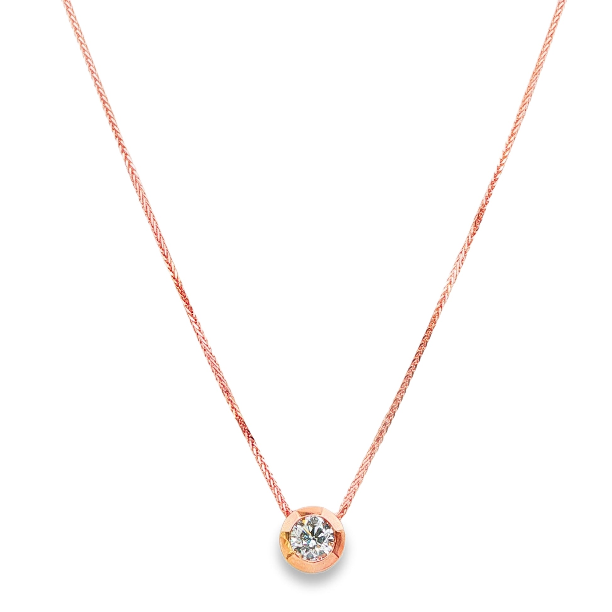 14K Rose gold solitaire necklace set with a round brilliant diamond. Item 24495 - ABC Jewelry Co