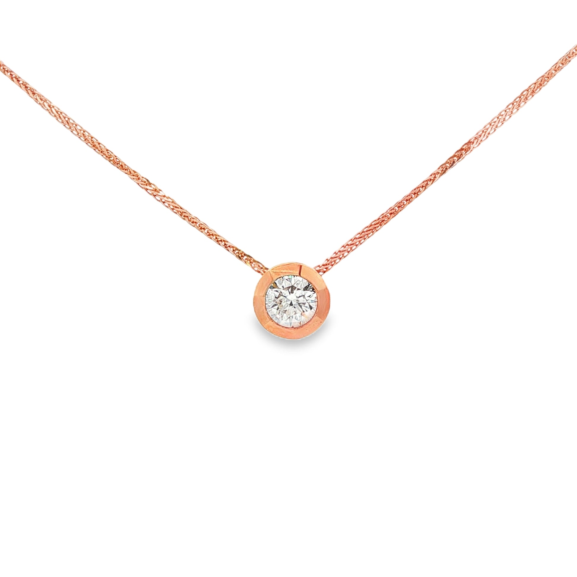 14K Rose gold solitaire necklace set with a round brilliant diamond. Item 24495 - ABC Jewelry Co