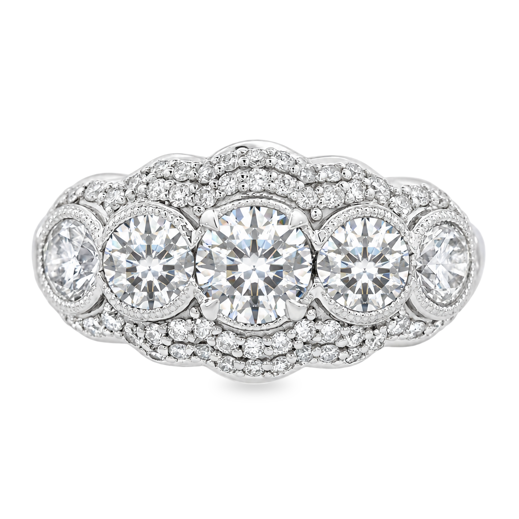 White gold 5 stone diamond ring with a double row halo around all stones. Shown on a clean white background.