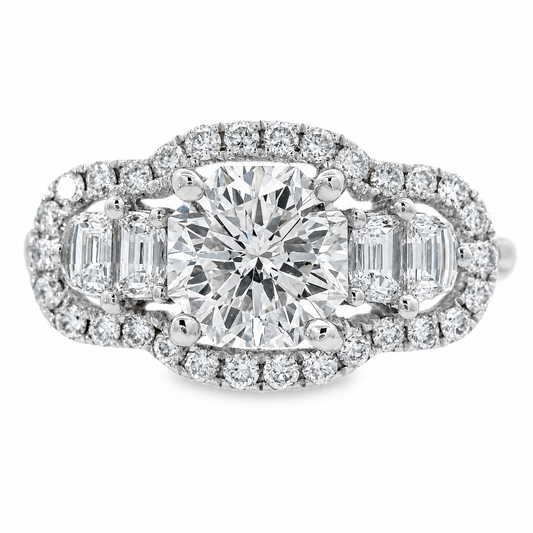 A white gold diamond ring with a octagonal center stone and half moon side stones, surrounded by a halo of small diamonds on a white background.