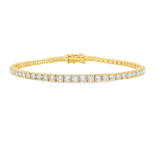 14K Yellow gold tennis bracelet set with round brilliant diamonds. Item J38987 - ABC Jewelry Co. 