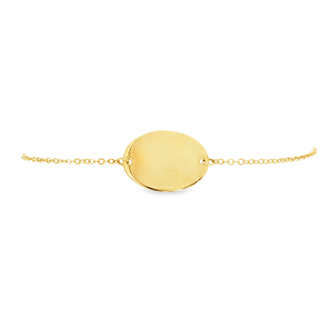 14K Yellow gold delicate chain bracelet with polished oval disc center piece. Item J30491 - ABC Jewelry Co.