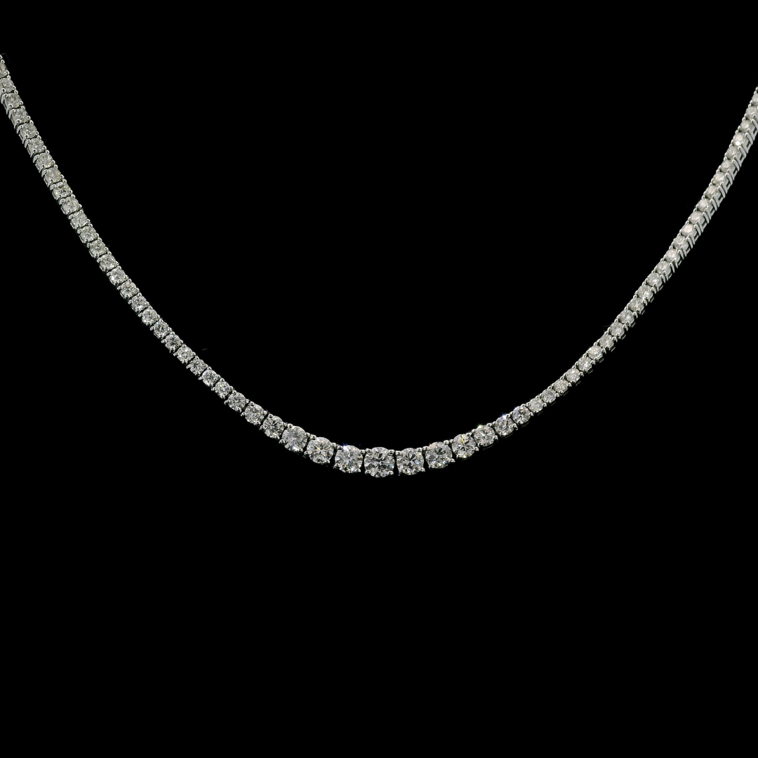  14K White Gold tennis necklace set with graduated round brilliant diamonds. Item J36990 - ABC Jewelry Co.