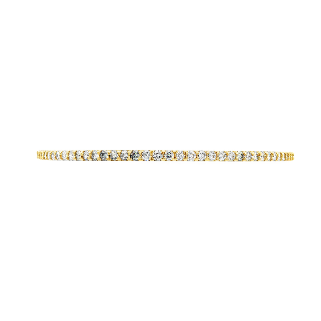 14K Yellow gold bangle bracelet set with round brilliant diamonds. Item J38576 - ABC Jewelry Co. 