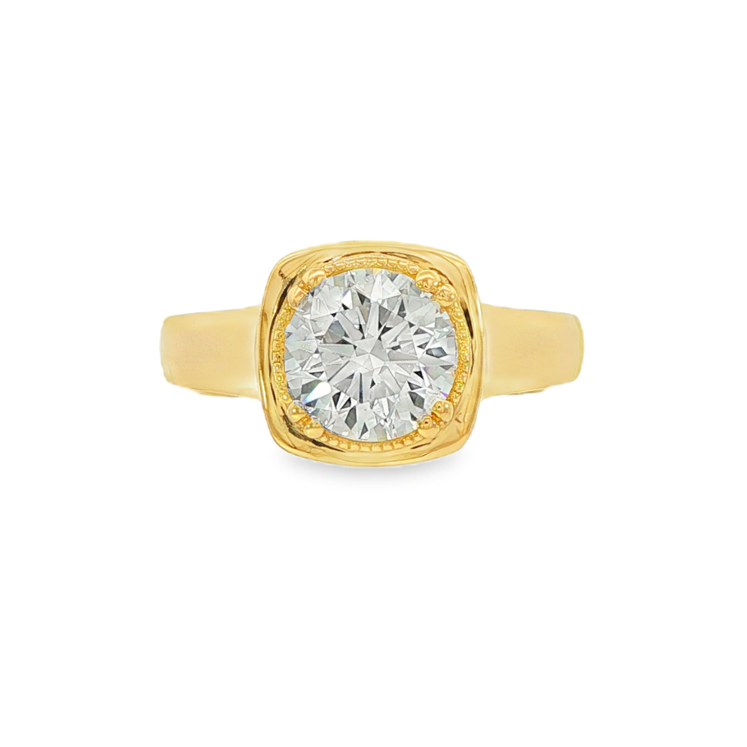14K Yellow gold ring set with a round brilliant diamond, featuring mill grain detailing. Item J38079 - ABC Jewelry Co.