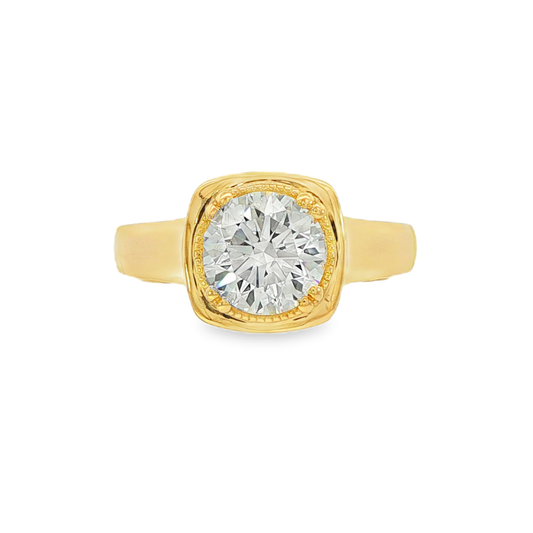 14K Yellow gold ring set with a round brilliant diamond, featuring mill grain detailing. Item J38079 - ABC Jewelry Co.