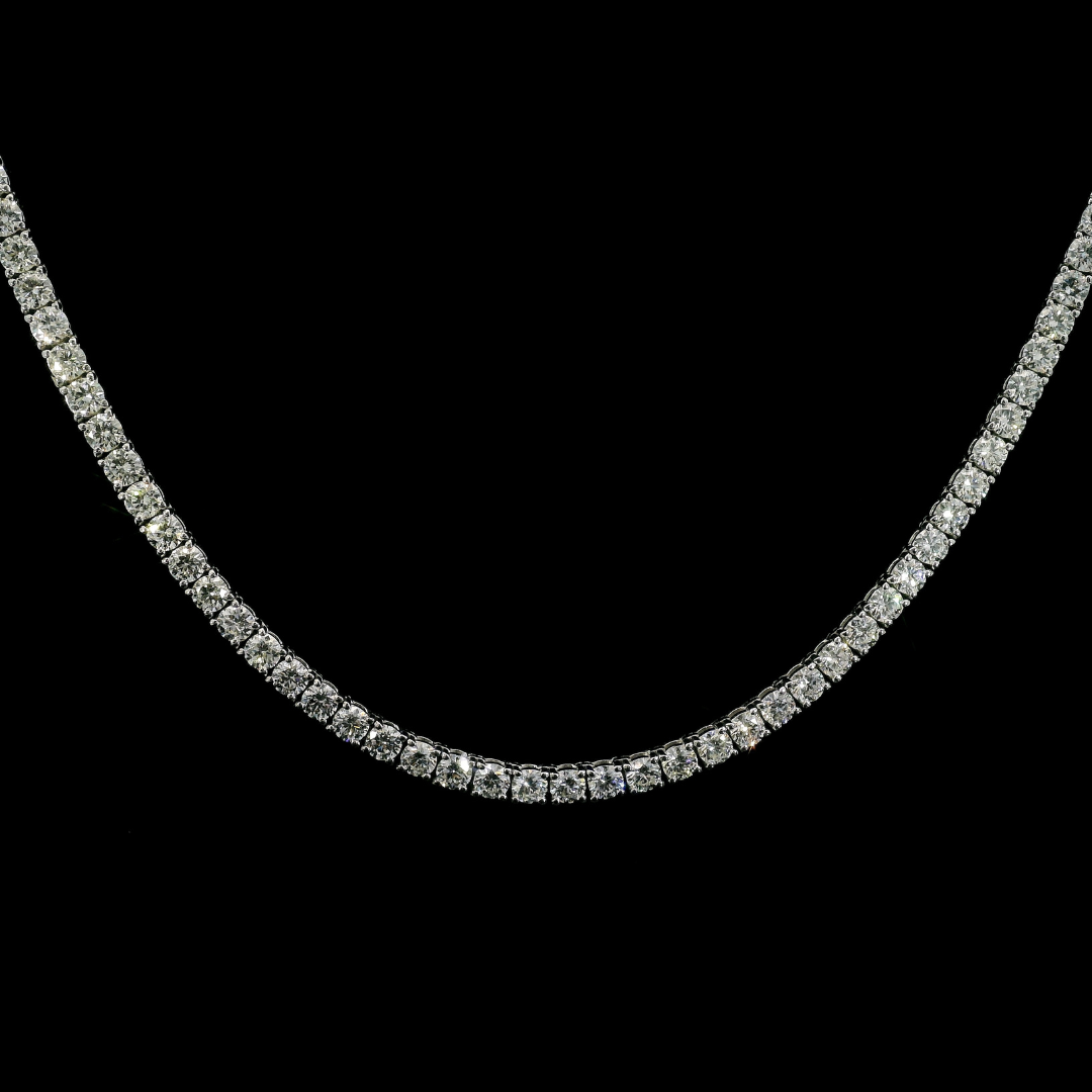 14K White gold tennis necklace set with round brilliant diamonds. Item J39087 - ABC Jewelry Co.