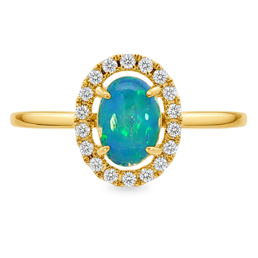 Yellow gold ring with a blue green oval shape opal surrounded by a diamond halo. Set on a clean white background