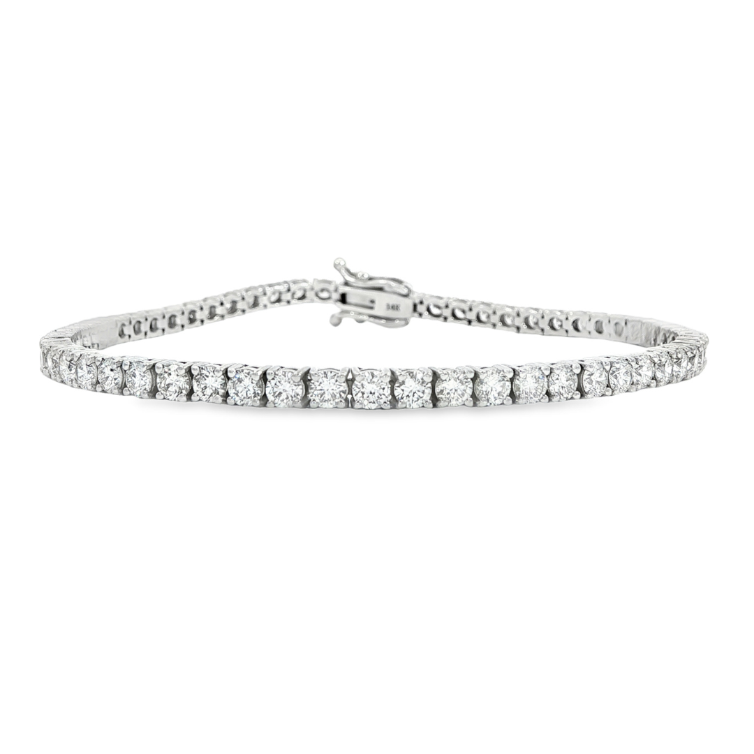 14K White gold tennis bracelet set with round brilliant diamonds. Item J38810 - ABC Jewelry Co