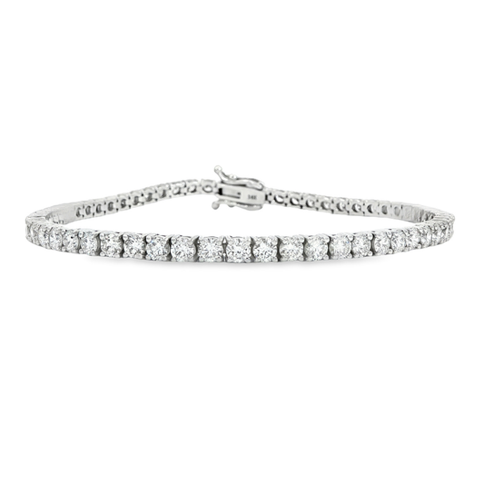 14K White gold tennis bracelet set with round brilliant diamonds. Item J38810 - ABC Jewelry Co