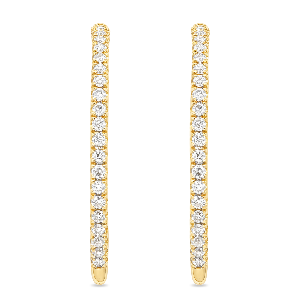 Yellow gold hoop earrings set with a row of round diamonds. Shown on a clean white background.