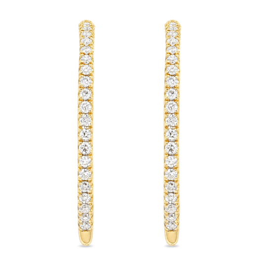 Yellow gold hoop earrings set with a row of round diamonds. Shown on a clean white background.