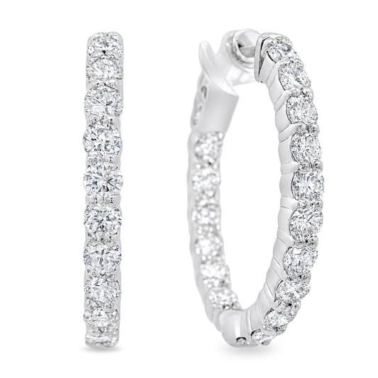 A pair of white gold hoop earrings set with round-cut clear gemstones, shown from two angles on a plain white background.