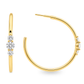 A pair of gold hoop earrings with three round-cut clear stones on each earring, shown on a clean white background.