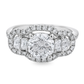A white gold diamond ring with a octagonal center stone and half moon side stones, surrounded by a halo of small diamonds on a white background.