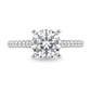 White gold ring with diamonds set along the band, center set with round diamond. Shown on a clean white background.
