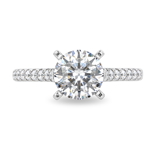 White gold ring with diamonds set along the band, center set with round diamond. Shown on a clean white background.