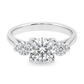 White gold three stone ring with round brilliant diamonds. Set on plain white background. 