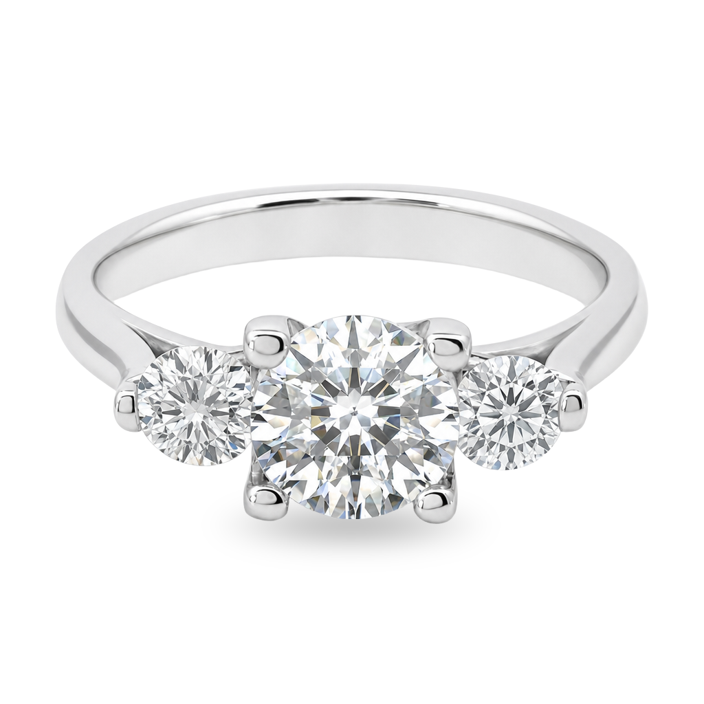 White gold three stone ring with round brilliant diamonds. Set on plain white background. 