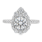 White gold ring set with a round diamond surrounded by a pear shape halo of graduated diamonds with diamonds set along the band. Shown on a clean white background.