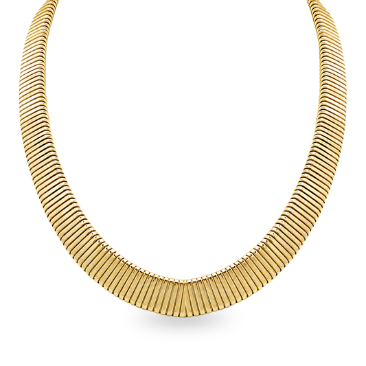 A gold necklace with a curved, segmented design, displayed on a clean white background.
