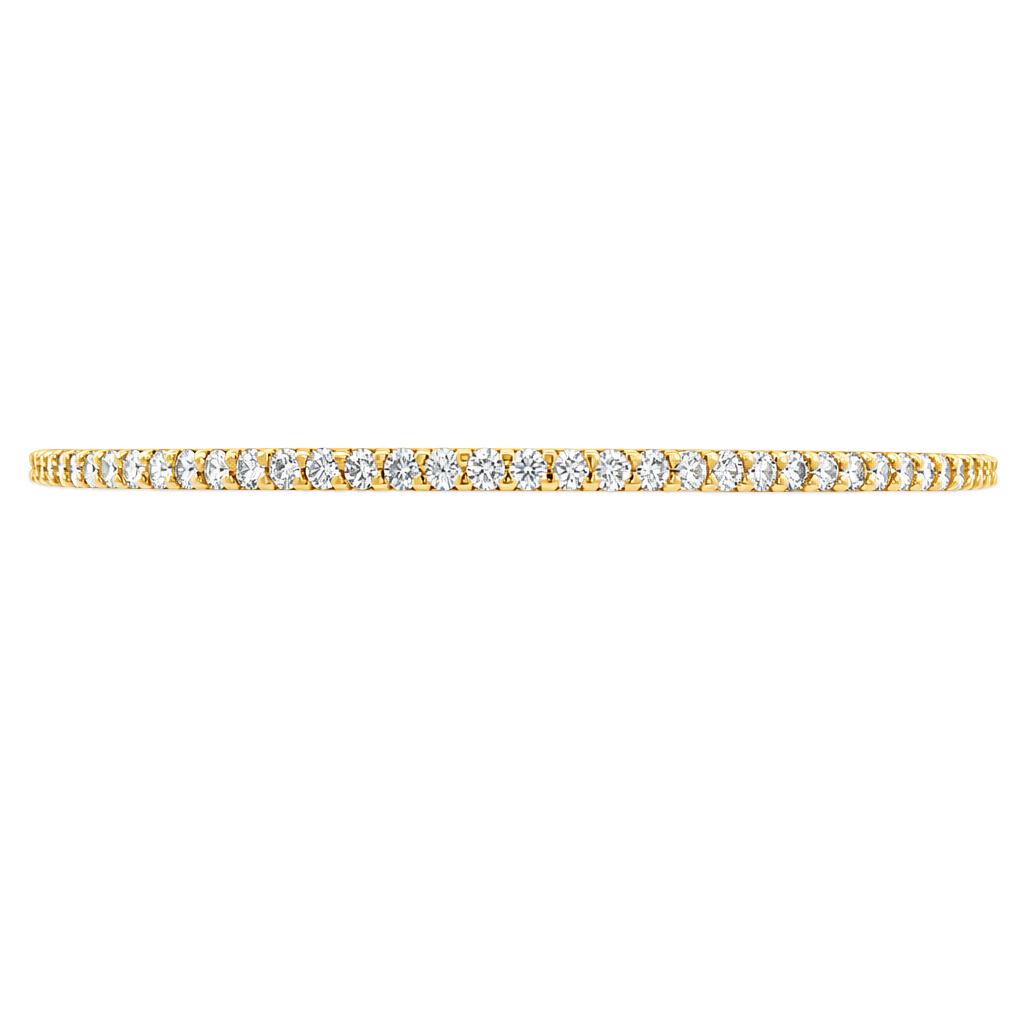 Yellow gold bangle set with a continuous row of round brilliant diamonds. Set on a clean white background. 